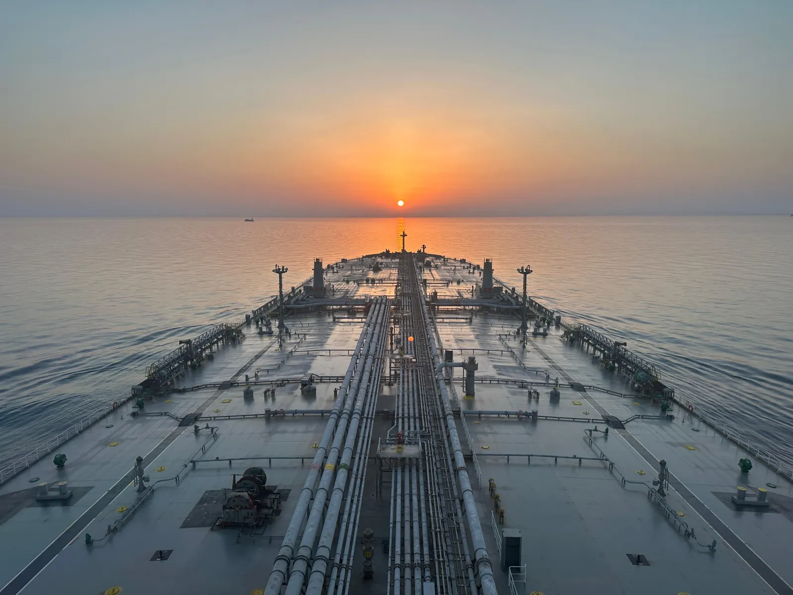 A PV Link Energy tanker at sea at sunset